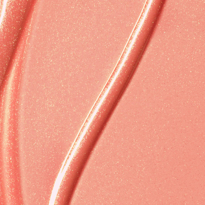 Rare Beauty by Selena Gomez
Positive Light Luminizing Lip Gloss Color: Beam - peachy coral with gold and pink pearl