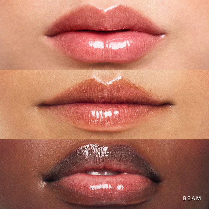 Rare Beauty by Selena Gomez
Positive Light Luminizing Lip Gloss Color: Beam - peachy coral with gold and pink pearl