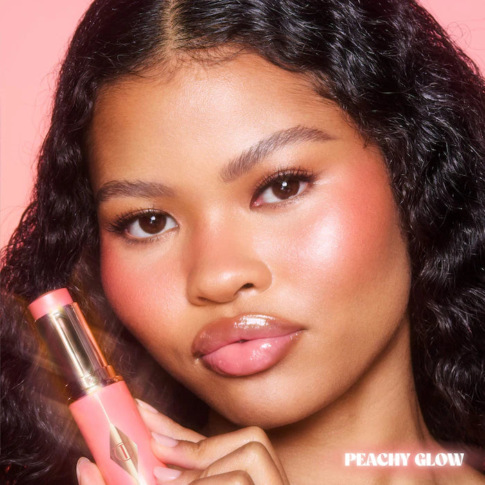 Charlotte Tilbury
Unreal Lip + Cheek Glow Blush Stick with Hyaluronic Acid Color: Peach Glow - poppy peach