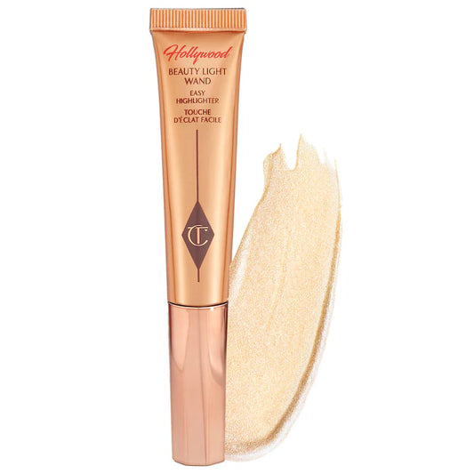 Charlotte Tilbury 
Beauty Highlighter Wand Color: Spotlight - rose gold with silver light