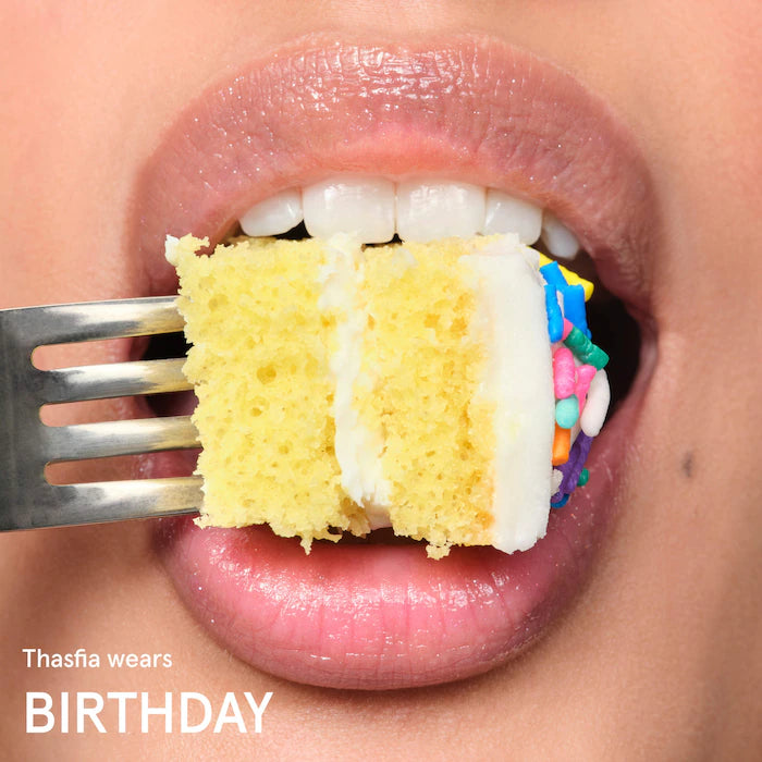 Glossier 
Balm Dotcom Lip Balm and Skin Salve Color: Birthday - soft shimmer clear