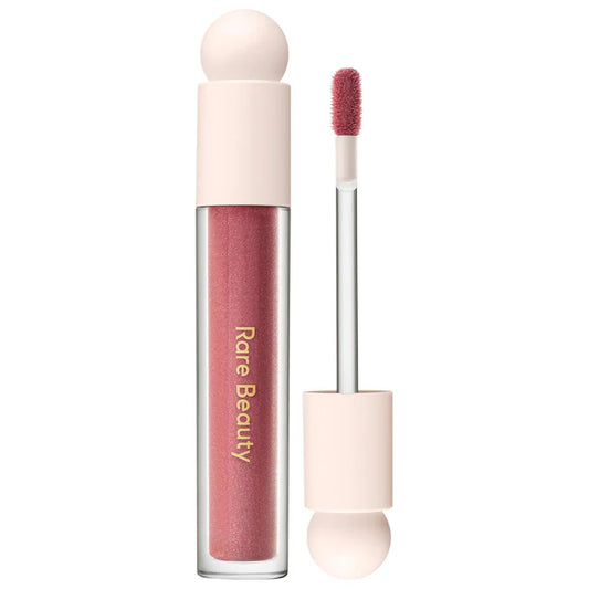 Rare Beauty by Selena Gomez 
Positive Light Luminizing Lip Gloss Color: Glimmer - rose gold with champagne and rose gold pearl