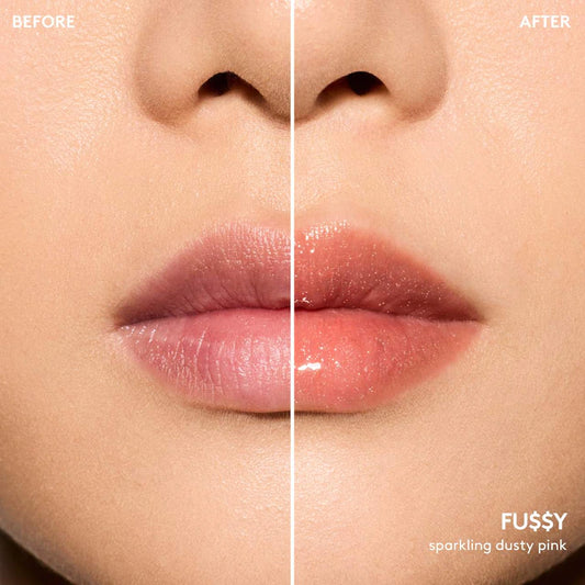 Fenty Beauty by Rihanna 
Gloss Bomb Oil Luminizing Lip Oil 'N Gloss Color: Fu$$Y - sparkling dusty pink