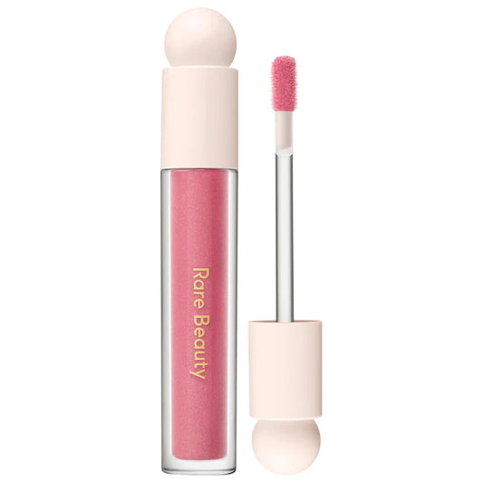 Rare Beauty by Selena Gomez 
Positive Light Luminizing Lip Gloss Color: Flicker - pink with pink and blue pearl