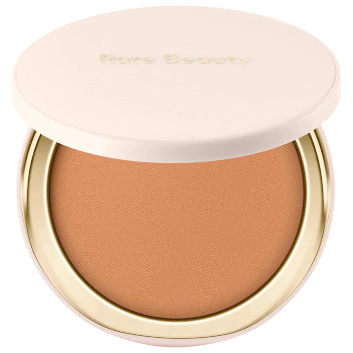 Rare Beauty by Selena Gomez 
Warm Wishes Soft Matte Powder Bronzer Color: Sun Blaze - tan with neutral warm undertone