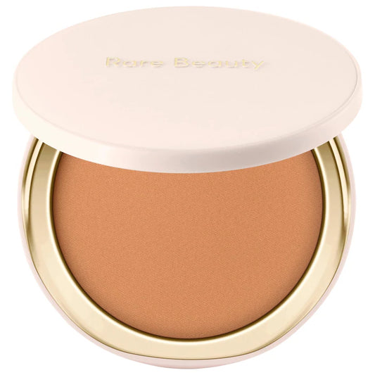 Rare Beauty by Selena Gomez 
Warm Wishes Soft Matte Powder Bronzer Color: Sun Blaze - tan with neutral warm undertone