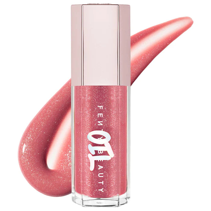 Fenty Beauty by Rihanna 
Gloss Bomb Oil Luminizing Lip Oil 'N Gloss Color: Fu$$Y - sparkling dusty pink