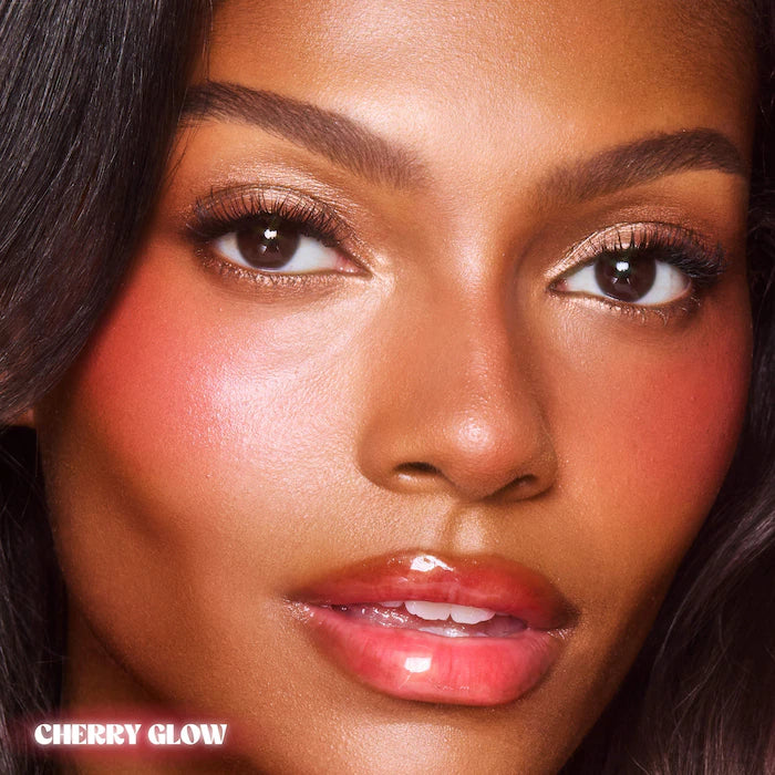 Charlotte Tilbury 
Unreal Lip + Cheek Glow Blush Stick with Hyaluronic Acid Color: Cherry Glow - deep cherry red