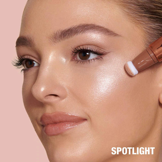 Charlotte Tilbury 
Beauty Highlighter Wand Color: Spotlight - rose gold with silver light